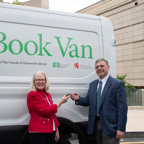 Guy and Girl in front of book van